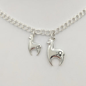 Alpaca Huacaya hand-made Sterling silver crescent shaped charms with a gender accent stamp.  2 sizes available; shiny finish