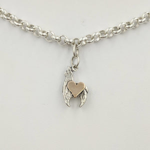 Sterling silver crescent charm with 14K rose gold heart accent.