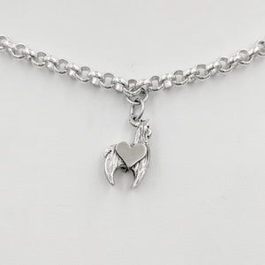 Sterling silver crescent charm with sterling silver heart accent.