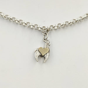 Sterling silver crescent charm with 14K yellow gold heart accent. 