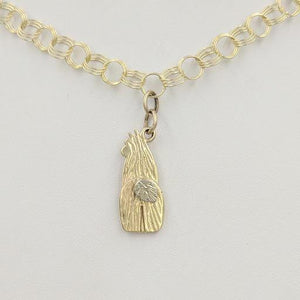View from behind - 14K Yellow Gold  Swoosh Tush Alpaca Huacaya Charm  with 14K White Gold tail