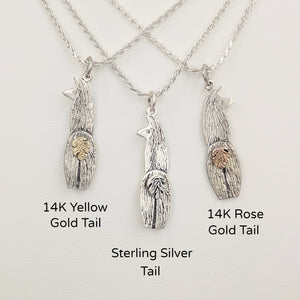Viewed from behind, 3 choices of Silver Swoosh Tush Llama Pendants - one with a 14K Yellow Gold tail, one with a Sterling Silver tail, and one with a 14K Rose gold tail