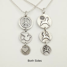 Load image into Gallery viewer, Both sides of the Alpaca or Llama Reversible Tri-Coin Drop Pendant - one side with pronking animals and sun, moon and star accents - the reverse side has a peace sign, dove and a heart - Sterling Silver